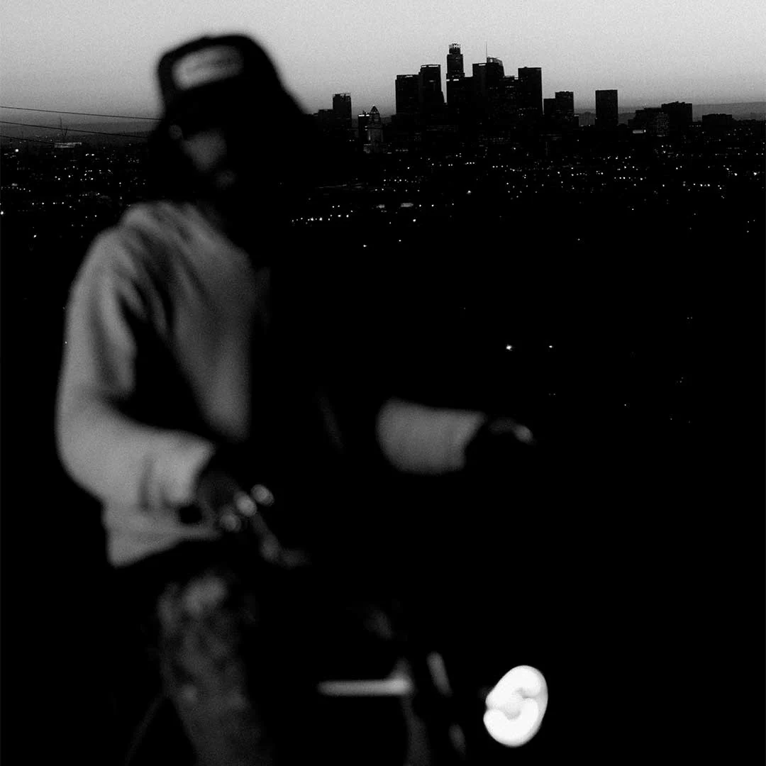 Rider with purple bike at dusk