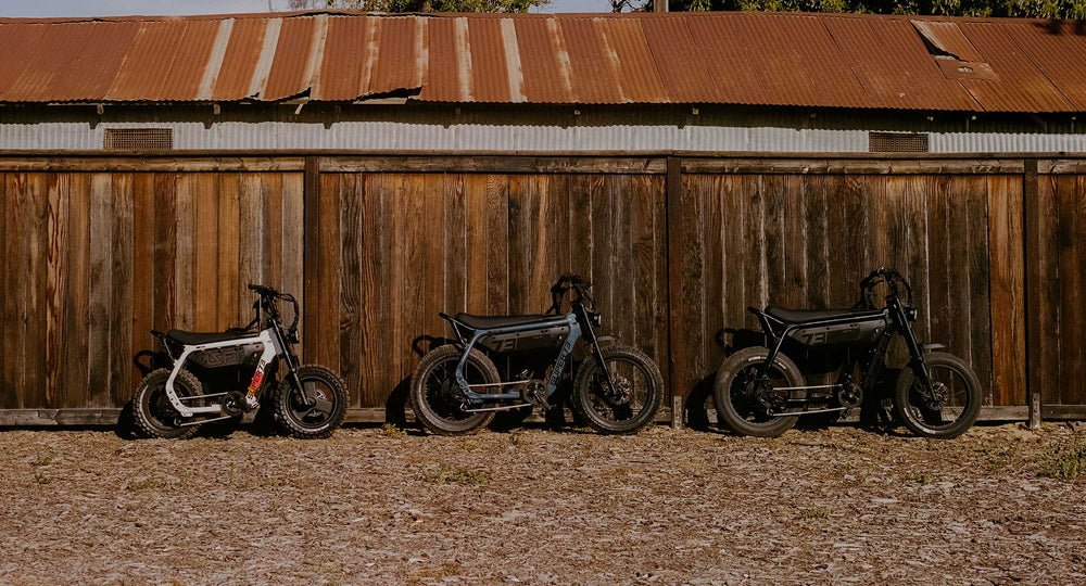 Three A-Series bikes lined up outdoors