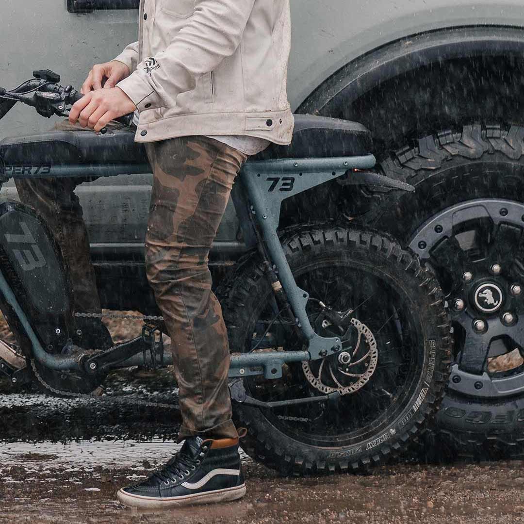 Rider beside an S2 Laguna on a sandy path