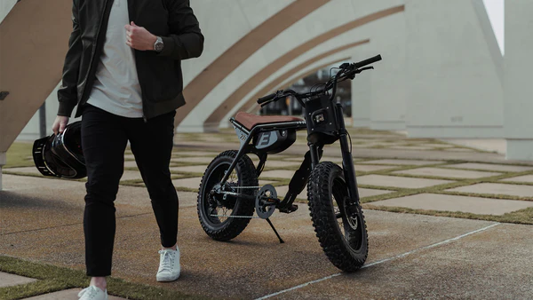 Rider walking toward a parked Z-Series bike in the city
